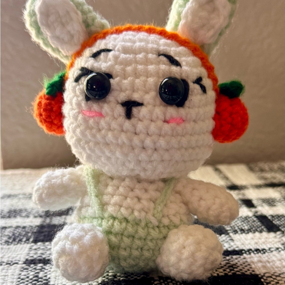 Handmade White Crochet Bunny Plush with Orange Headphones and Light Green Outfit